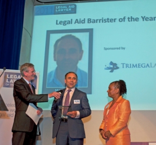 Marc Willers receiving his award from Doreen Lawrence and John Howard